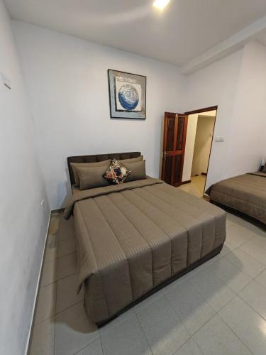 Кровать или кровати в номере Trail Town Lodge
