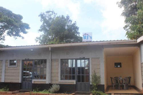a building with a ups sign on top of it at RJ's Retreat Migwani Town in Kathera