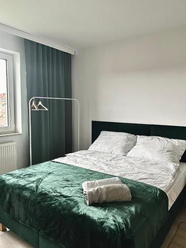 Postel nebo postele na pokoji v ubytování Madi Apartamenty