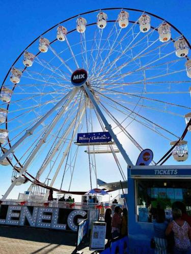 a large ferris wheel at a carnival at entire beachfront apartment 5 Esplanades seaviews in Glenelg