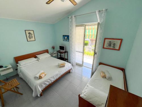Ένα ή περισσότερα κρεβάτια σε δωμάτιο στο Casa vacanze Aurora