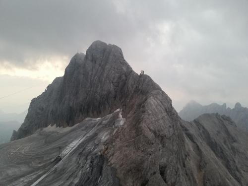 a person standing on the top of a mountain at Waldhaus in Sankt Martin am Tennengebirge