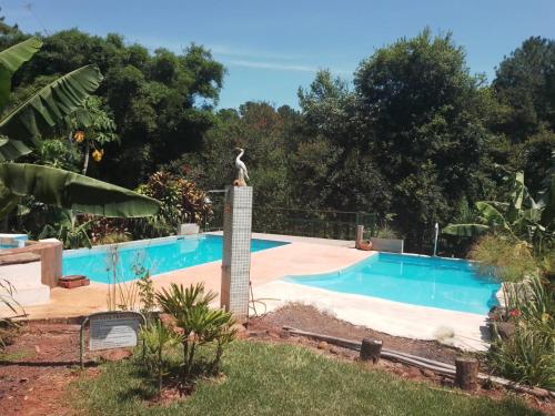 Swimmingpoolen hos eller tæt på Cabañas y Apart Guayubira