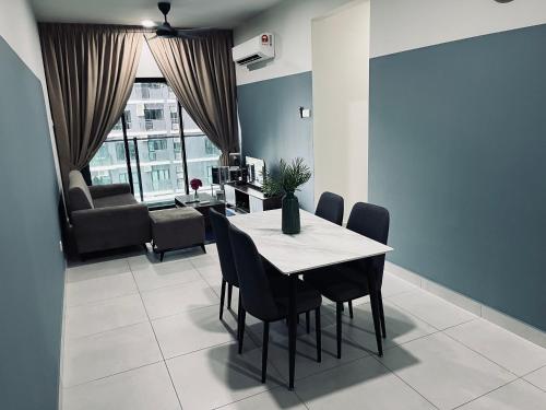 a dining room with a table and chairs at Majestic maxim 3BR luxury family house MRT kuala lumpur in Kuala Lumpur