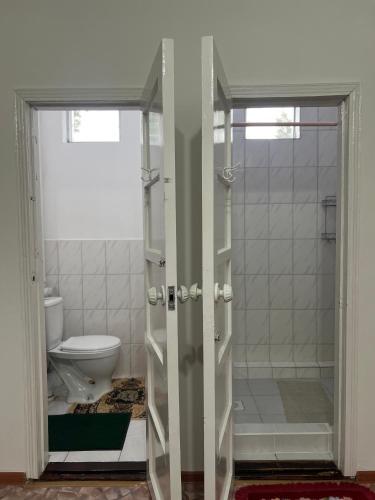 a bathroom with a shower and a toilet at Абия in Cholpon-Ata