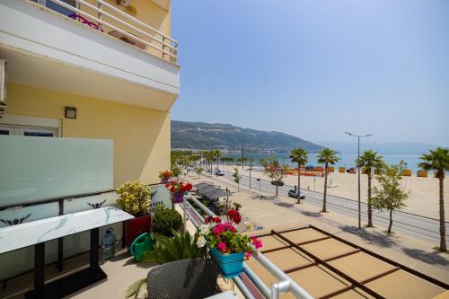 a balcony of a building with flowers on it at Veranda Boutique Hotel in Vlorë