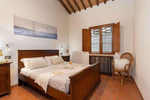 A bed or beds in a room at Holiday home in Villamagna - Toskana 44123