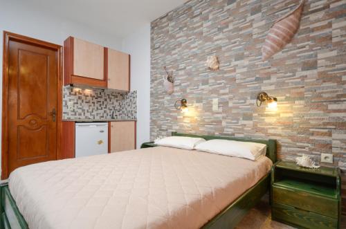 Posteľ alebo postele v izbe v ubytovaní Orama Apartments
