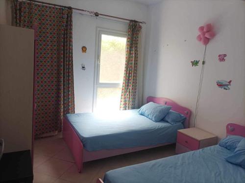 Ένα ή περισσότερα κρεβάτια σε δωμάτιο στο Golf porto marina