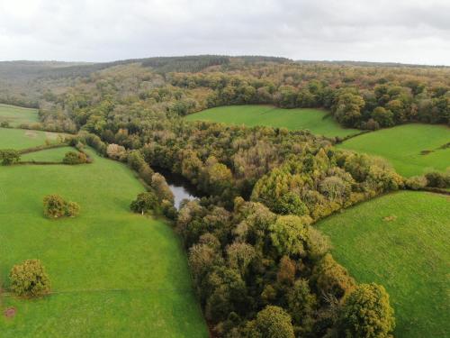 an aerial view of a river in a field at Harcombe House Bungalow 3 in Newton Abbot