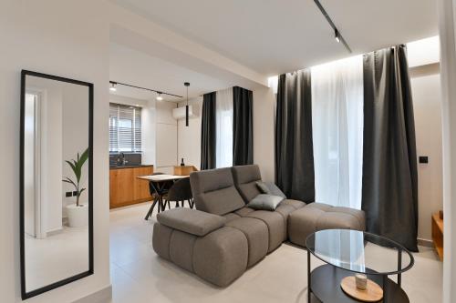 a living room with a couch and a table at NATIVO in Preveza