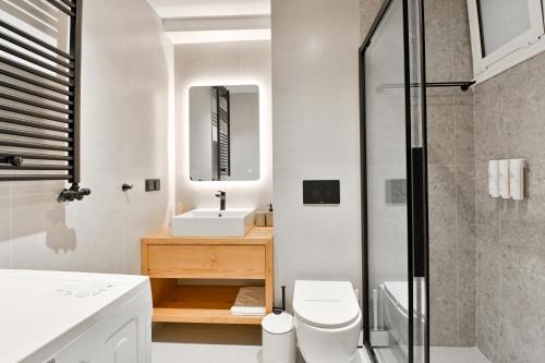 a bathroom with a toilet and a sink and a shower at NATIVO in Preveza