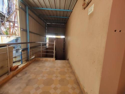 an empty hallway with a staircase in a building at Maison Douce in Chennai