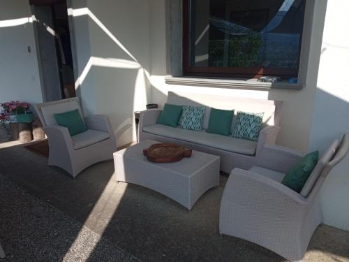 a living room with two chairs and a couch at Bergamo bnb in Villa di Serio