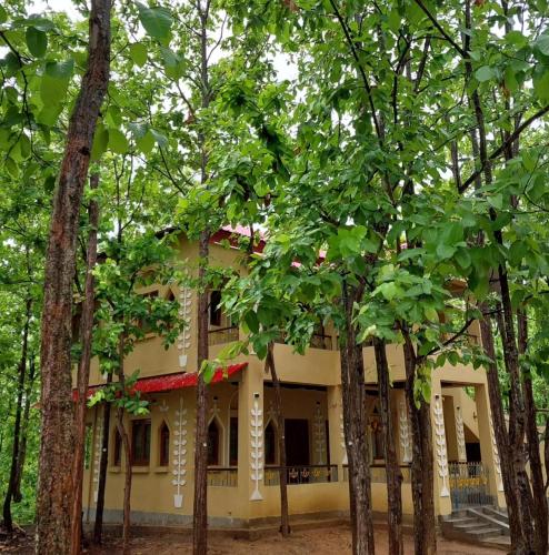 a house in the middle of trees at Sobuj Thikana Villa Resort and Jungle camp in Jhārgrām