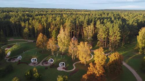 an aerial view of a park with strange buildings at LVM dabas parka glempings in Tērvete