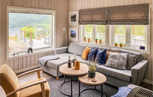 a living room with a couch and a table at Stunning Home In Hebnes With Kitchen in Hebnes
