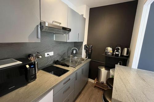 Η κουζίνα ή μικρή κουζίνα στο Petit Hollywood 2 personnes