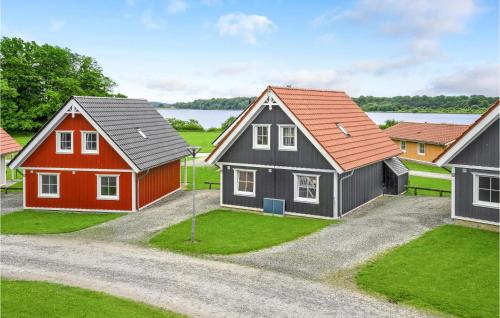 three houses in a row with a driveway at Gorgeous Home In Gråsten With Sauna in Gråsten