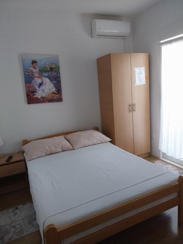Postel nebo postele na pokoji v ubytování Apartmani Liberan Neum
