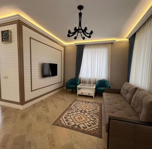 TV a/nebo společenská místnost v ubytování Коттедж Иссык Куль