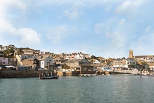 a body of water with a town in the background at The Treehouse at Salcombe Farm in Salcombe