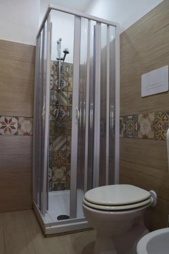 a bathroom with a toilet and a shower at Villa Sandro in Agropoli