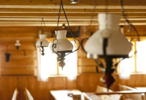 a row of lights hanging from the ceiling of a restaurant at Penzión Koliba in Dolný Kubín