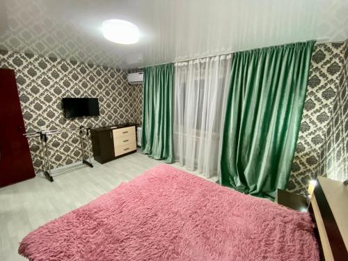 Llit o llits en una habitació de Апартаменты