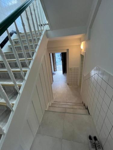 a hallway with a staircase in a building at Top Apartments in Kamen - Cozystays in Kamen
