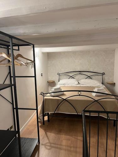 a bedroom with a bed and a book shelf at Sweet home Palermo in Palermo