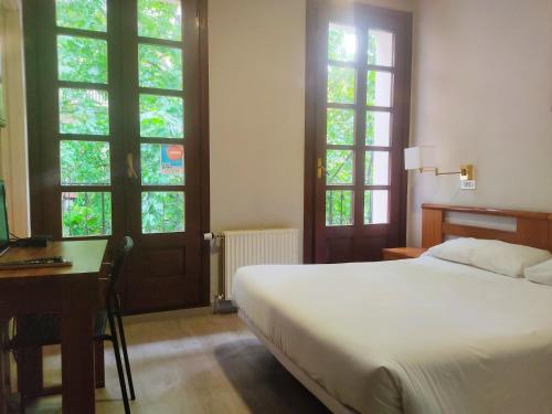 Postel nebo postele na pokoji v ubytování Hotel Lauxeta Berria