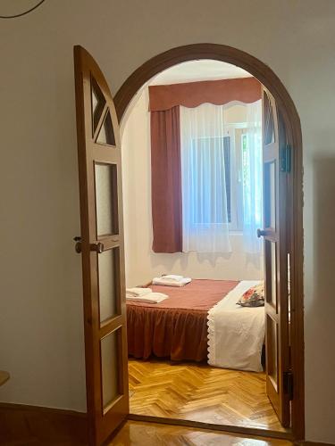 an open door to a bedroom with a bed at Cozy Apartment with Private Terrace in Mandre