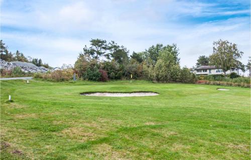 a view of the green at a golf course at Stunning Home In Frosta in Tautra