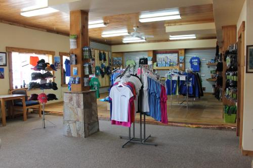 a store with shirts on display in a room at Whitney Portal Hotel And Hostel in Lone Pine