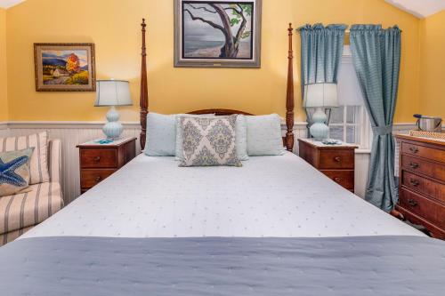 a bedroom with a large bed and two night stands at Holiday Guest House Bed & Breakfast in Wells
