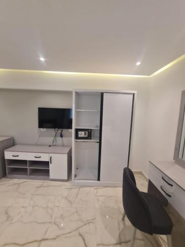 TV a/nebo společenská místnost v ubytování El Mesaadya Hotel فندق المساعدية