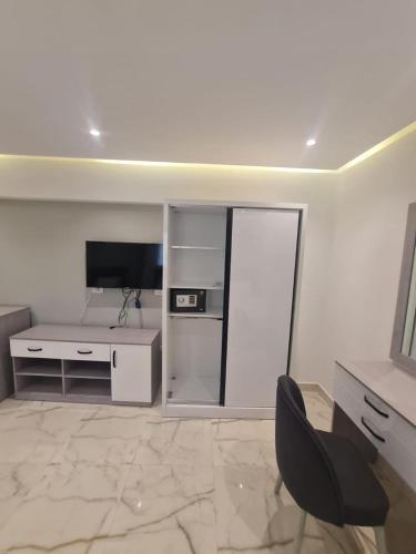 TV a/nebo společenská místnost v ubytování El Mesaadya Hotel فندق المساعدية