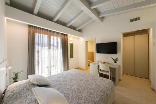 Postel nebo postele na pokoji v ubytování Domu Noa Hotel