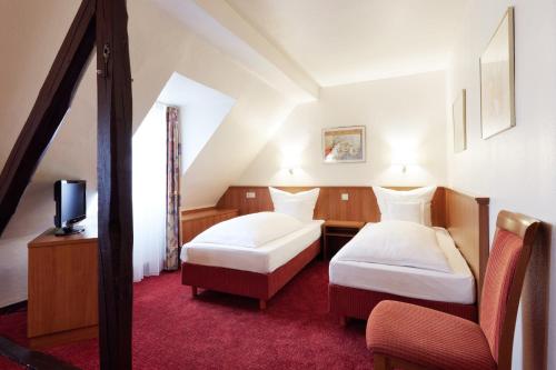 Un pat sau paturi într-o cameră la Doria