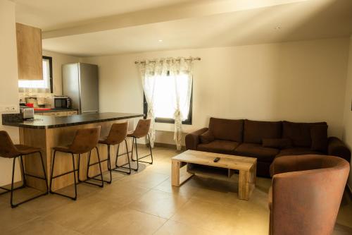 a living room with a couch and a table at Domaine Saint Thomas in Argelès-sur-Mer