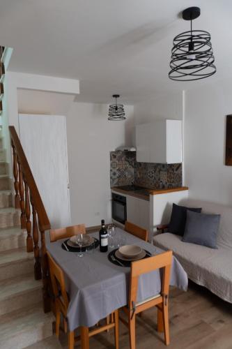 a living room with a table and a couch at Il nido dell'aquila-Lugnano in Teverina in Lugnano in Teverina