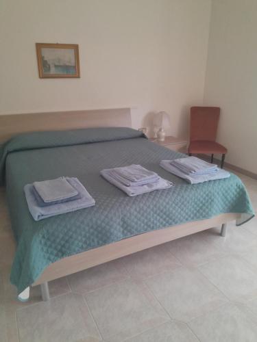 Ένα ή περισσότερα κρεβάτια σε δωμάτιο στο "SHARDANA" CASA VACANZe