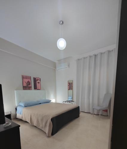 Ένα ή περισσότερα κρεβάτια σε δωμάτιο στο Casa Vacanze Letizia
