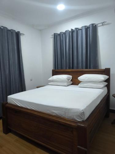 Ένα ή περισσότερα κρεβάτια σε δωμάτιο στο PM Lodge and Restaurant