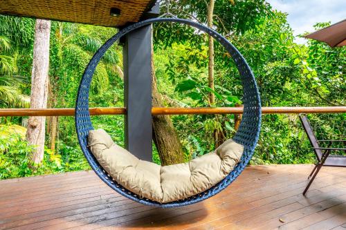 a swing on the deck of a boat at Casa Natu Ilhabela Portinho in Ilhabela