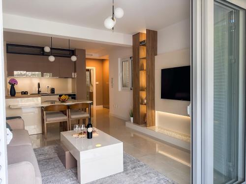 a living room and kitchen with a couch and a table at ChillOut apartment in Kotor Bay in Kotor