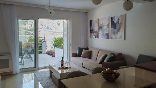 a living room with a couch and a table at ChillOut apartment in Kotor Bay in Kotor