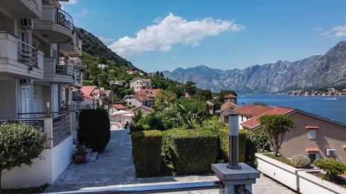 a town with a view of the water and mountains at ChillOut apartment in Kotor Bay in Kotor
