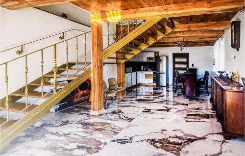 a living room with a staircase and a marble floor at Cozy Home In Wilczyce in Wilczyce
